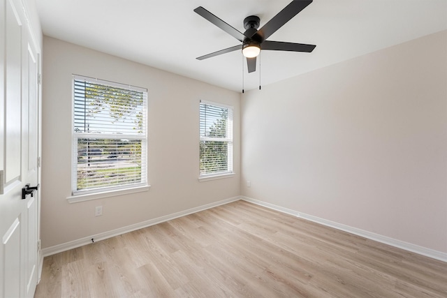 unfurnished room with ceiling fan and light wood-type flooring