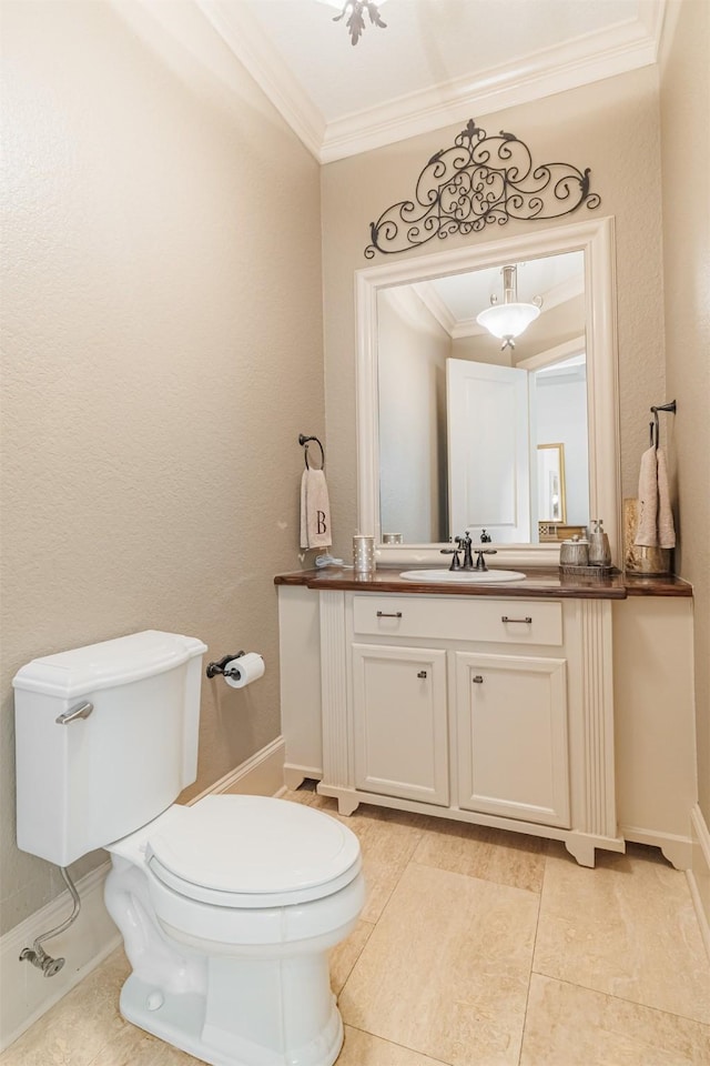 bathroom featuring crown molding, vanity, and toilet