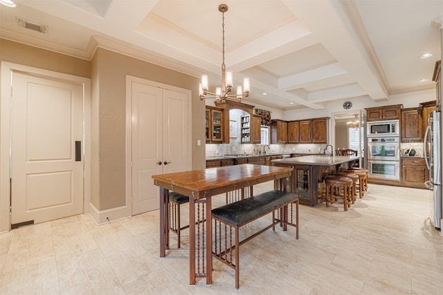 dining area featuring an inviting chandelier, coffered ceiling, beam ceiling, and crown molding