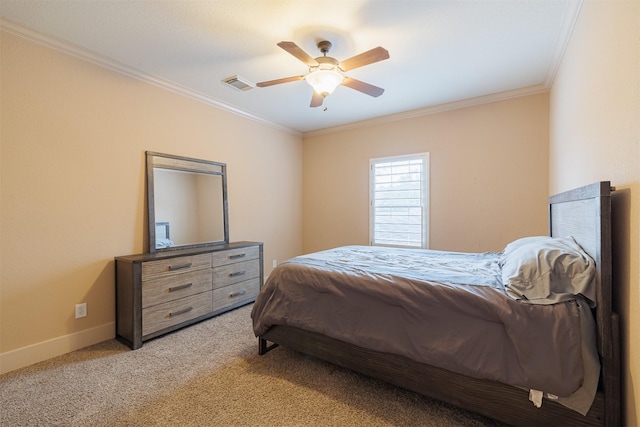 bedroom with ceiling fan, ornamental molding, and carpet flooring