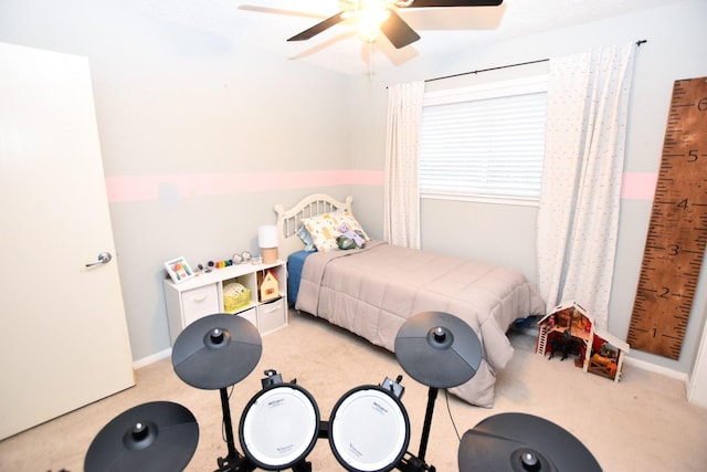 bedroom with ceiling fan and light colored carpet