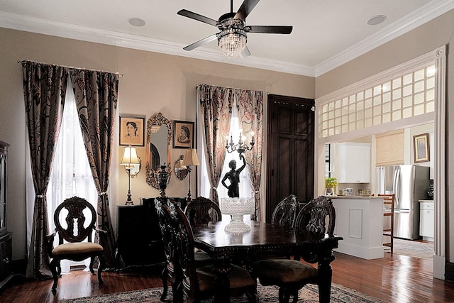 dining space featuring ceiling fan, ornamental molding, and hardwood / wood-style floors