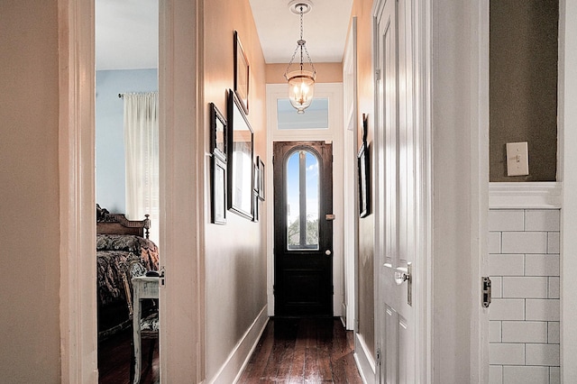 doorway featuring dark wood-type flooring