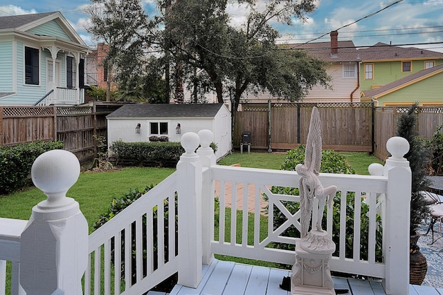 exterior space with a shed and a lawn