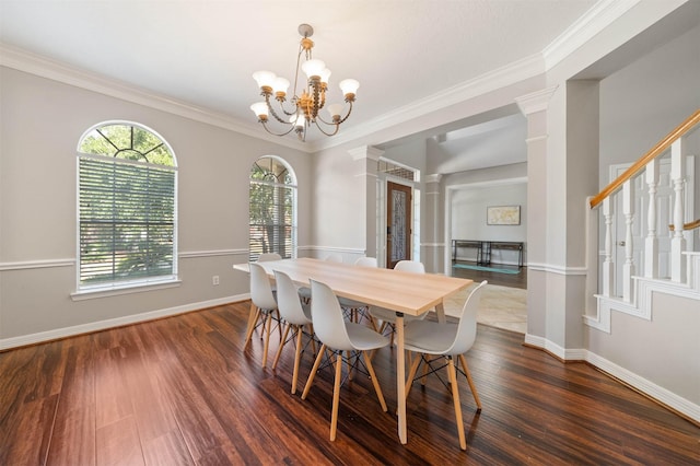 dining area featuring ornate columns, crown molding, a notable chandelier, and dark hardwood / wood-style flooring