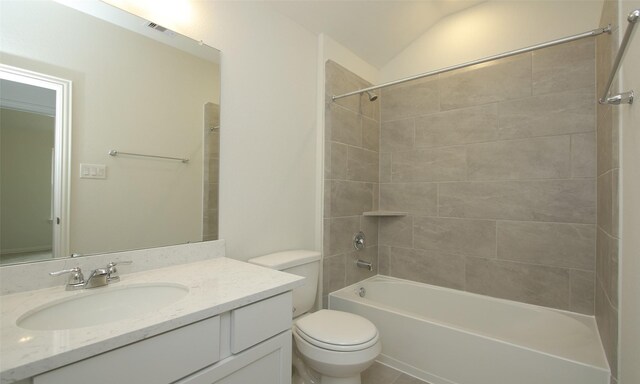 full bath featuring washtub / shower combination, vanity, vaulted ceiling, toilet, and visible vents