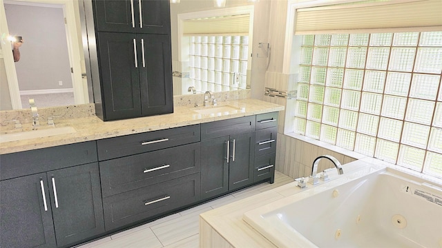 bathroom with vanity and a bath