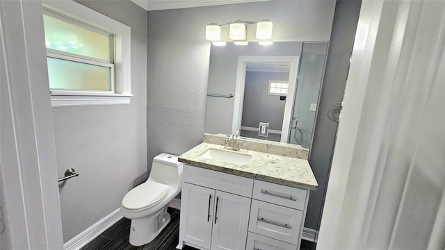 bathroom with vanity, hardwood / wood-style floors, and toilet