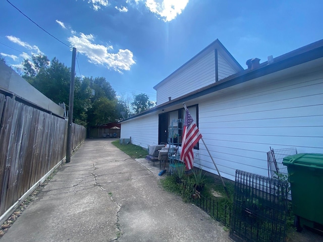 view of side of property with a patio