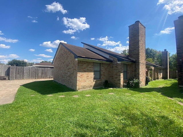 view of home's exterior featuring a lawn