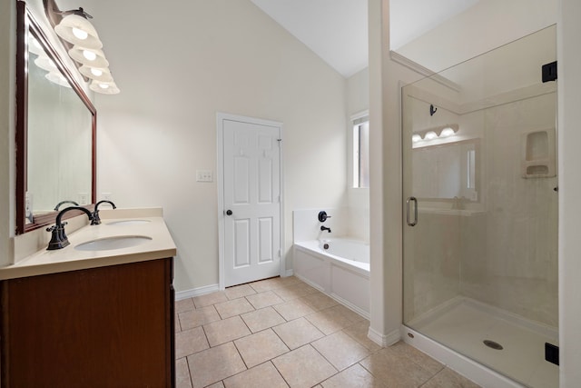 bathroom with vanity, vaulted ceiling, tile patterned floors, and separate shower and tub