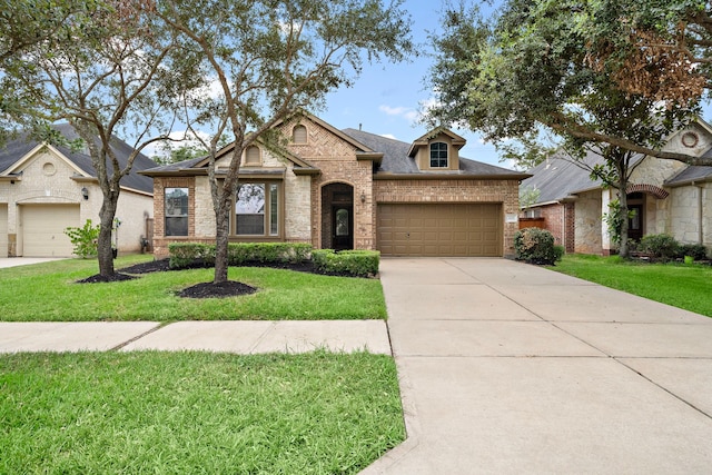 view of front facade featuring a garage and a front lawn