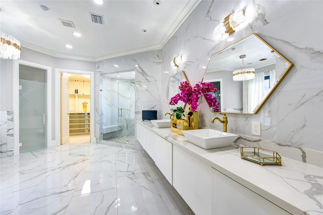 bathroom featuring an inviting chandelier, ornamental molding, an enclosed shower, and vanity