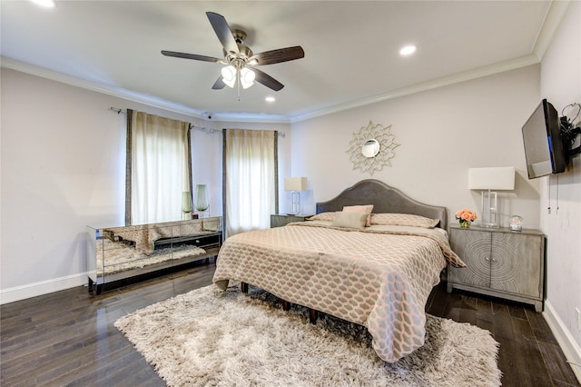 bedroom featuring crown molding, dark wood-type flooring, and ceiling fan