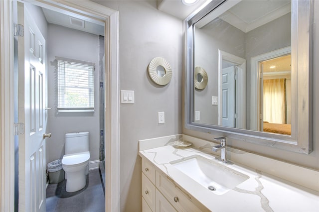 bathroom featuring vanity and toilet