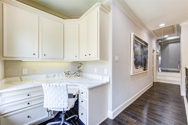 office area with ornamental molding and dark wood-type flooring