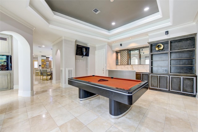 rec room with crown molding, pool table, a raised ceiling, and light tile patterned floors