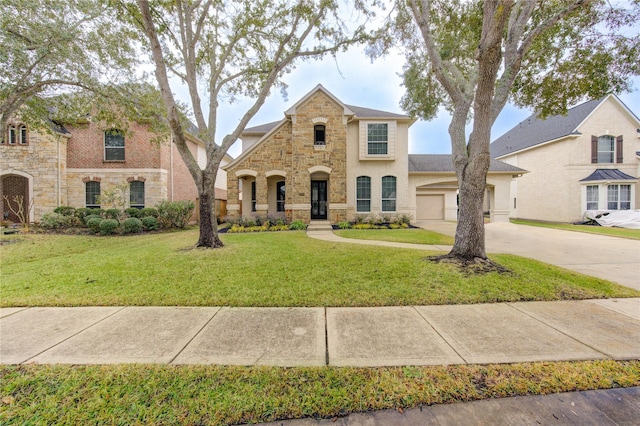 view of front facade with a garage and a front yard