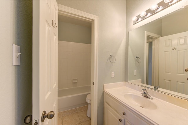 full bathroom featuring vanity, tile patterned floors, toilet, and washtub / shower combination