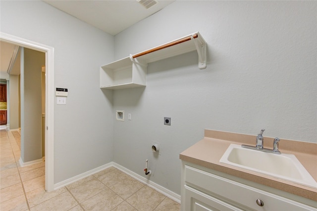 clothes washing area with gas dryer hookup, sink, light tile patterned floors, hookup for a washing machine, and hookup for an electric dryer