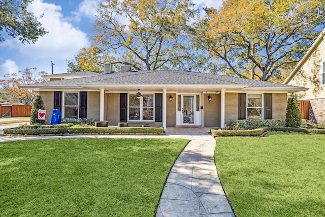 ranch-style home with a porch and a front yard