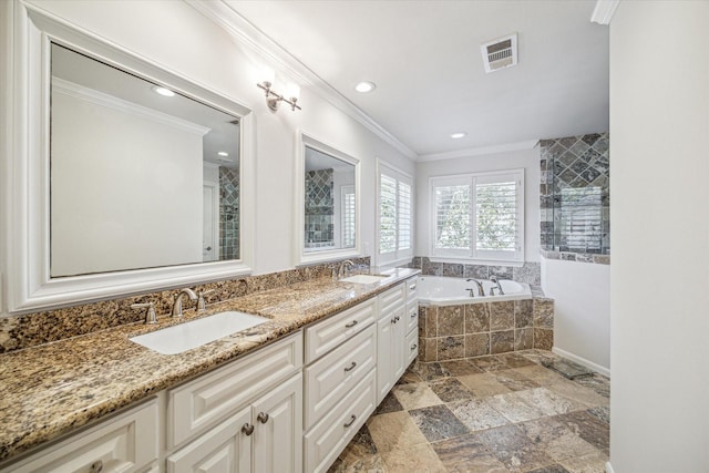 bathroom featuring tiled tub, crown molding, and vanity