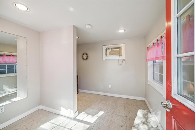 empty room featuring an AC wall unit