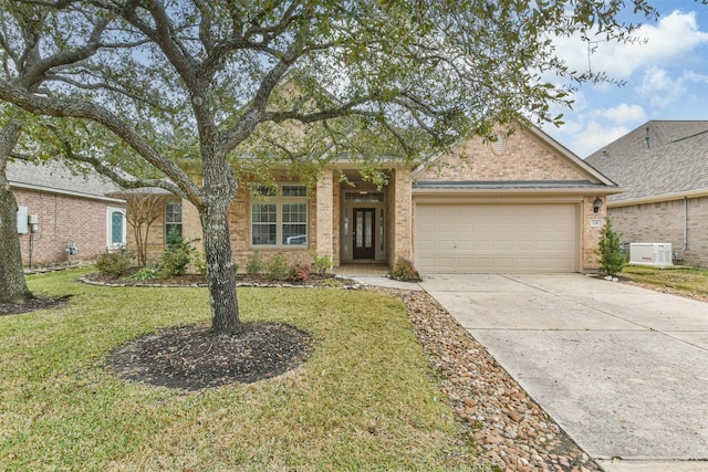 ranch-style house featuring a garage and a front lawn