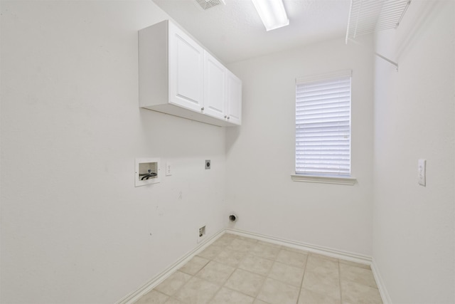 washroom with cabinets, hookup for an electric dryer, and washer hookup