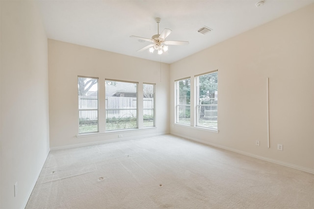 empty room with light carpet and ceiling fan