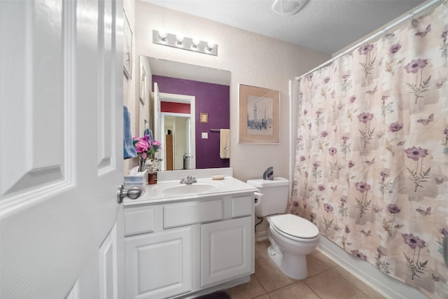 full bathroom featuring shower / tub combo, vanity, toilet, and tile patterned flooring