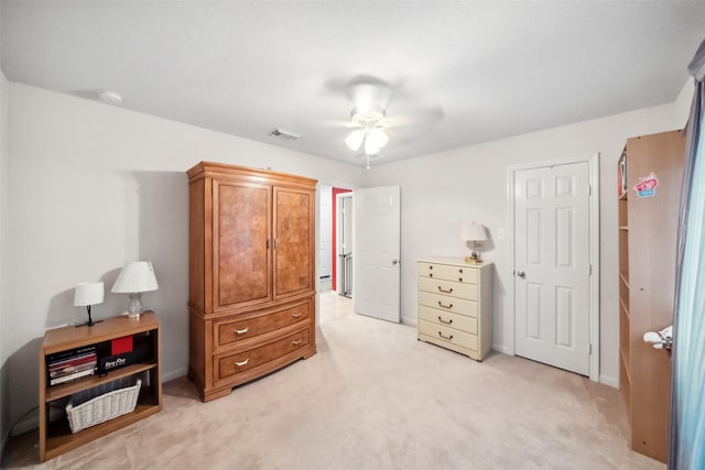 bedroom with light carpet and ceiling fan