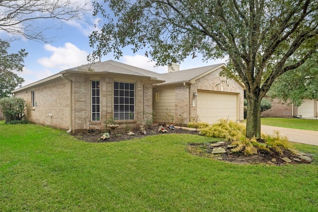 ranch-style home with a garage and a front lawn