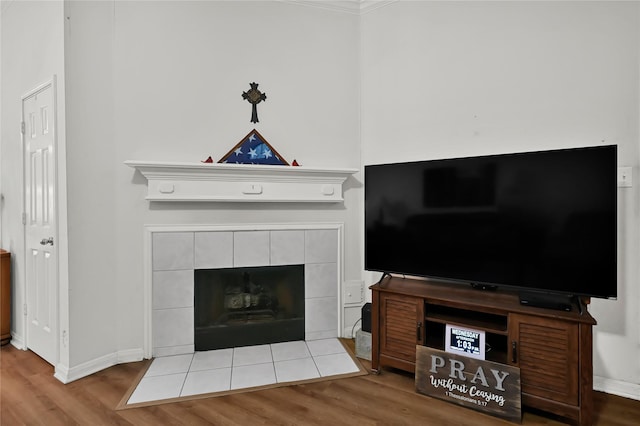 unfurnished living room with a fireplace and light wood-type flooring