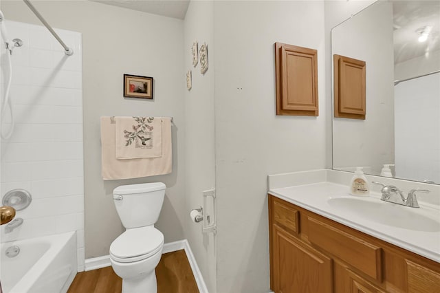 full bathroom with vanity, toilet, tub / shower combination, and wood-type flooring