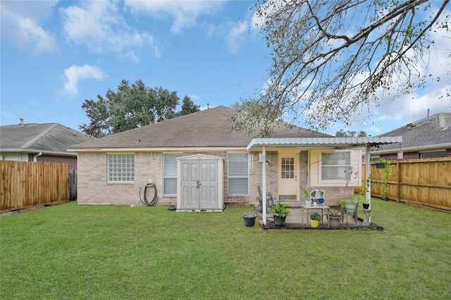 rear view of house featuring a yard and a patio