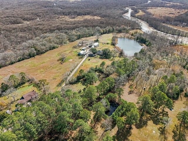 aerial view featuring a water view and a view of trees