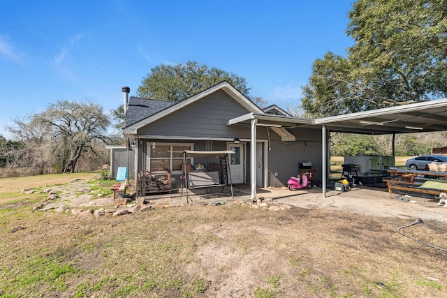 view of side of home featuring a yard