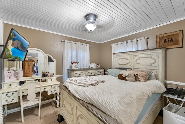 bedroom with light tile patterned floors, ornamental molding, and wooden ceiling