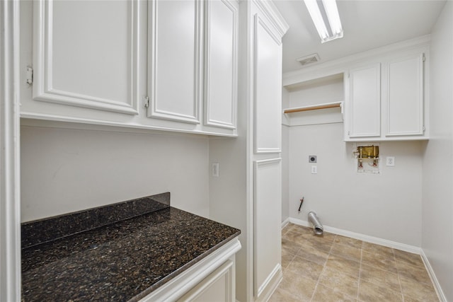 laundry area with washer hookup, cabinets, and hookup for an electric dryer