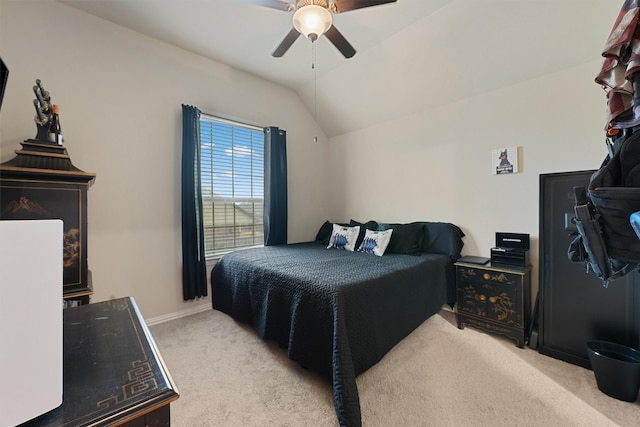 carpeted bedroom featuring ceiling fan and lofted ceiling