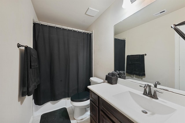 bathroom with tile patterned floors, vanity, and toilet