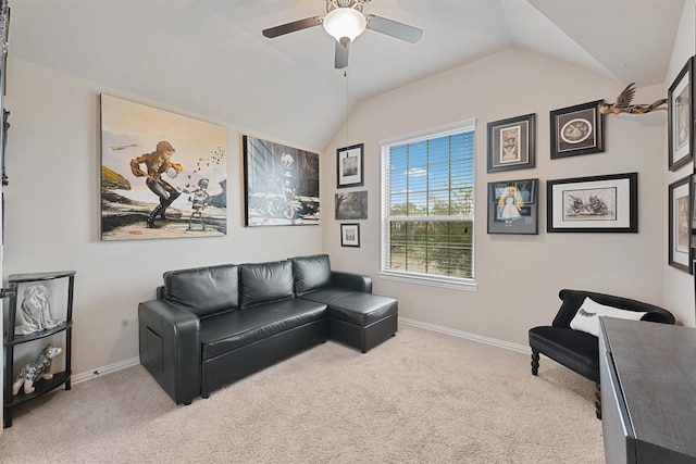 living room featuring lofted ceiling, light colored carpet, and ceiling fan