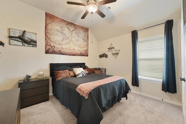 bedroom featuring lofted ceiling, light carpet, and ceiling fan