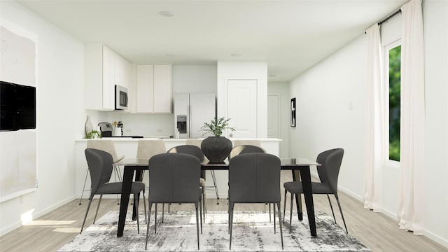 dining area with light wood-type flooring