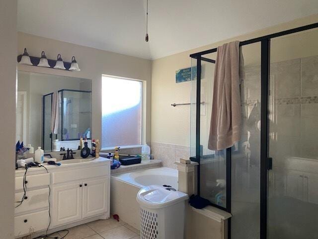 bathroom featuring vanity, tile patterned floors, and plus walk in shower