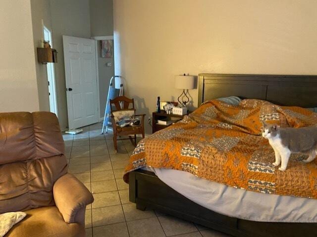 bedroom featuring light tile patterned flooring