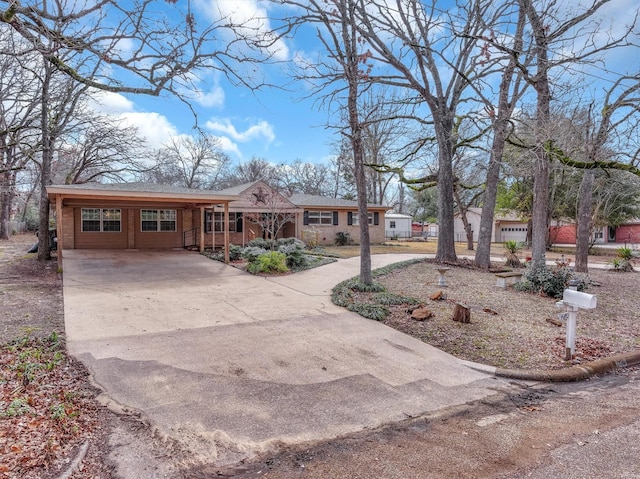 ranch-style home featuring a carport