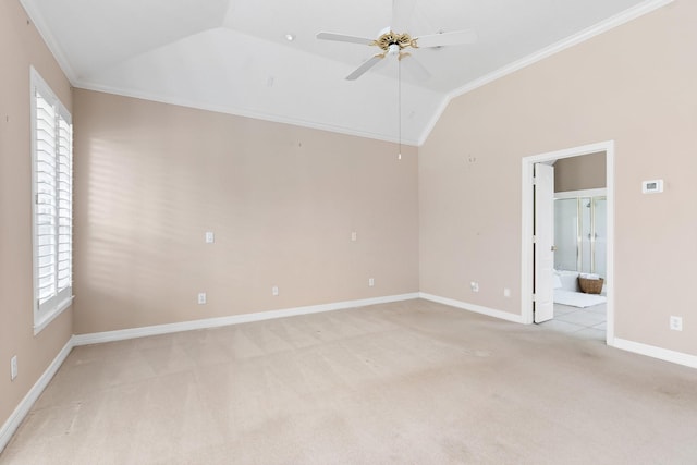 carpeted empty room featuring crown molding, lofted ceiling, a wealth of natural light, and ceiling fan