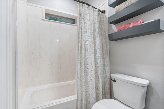 bathroom featuring toilet and shower / bath combo with shower curtain